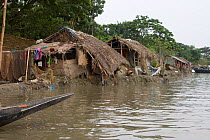 Homes threatened by rising sea levels, Passur river, Ganges delta, Bangladesh, July 2008