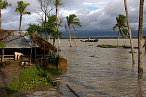 Home threatened by rising sea levels, Passur river, Ganges delta, Bangladesh, July 2008