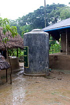 Water tank provided by Clean water project initiated by NGO, Uttaran, Ganges delta, Bangladesh, November 2008