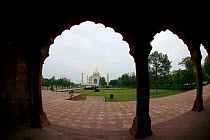Taj Mahal and palace viewed through silhouette of arches, tomb of Humayun, Uttar Pradesh, India, November 2008