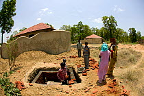 Building sewers for toilets to enable tourist lodge to function for Tiger tourism, Bandhavgarh NP, India, November 2008