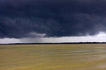 Dark monsoon clouds over the Pasur river, Ganges delta, Bangladesh, November 2008