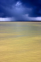 Dark monsoon rain clouds over the Pasur river, Ganges delta,  Bangladesh, November 2008