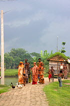 Villagers living in former river bed now dry due to siltation, complex effects of climate change, Ganges delta, Bangladesh, November 2008
