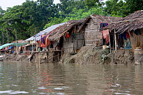 Homes threatened by rising sea levels, Passur river, Ganges delta, Bangladesh, November 2008