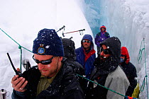 Cameraman, Ted Giffords, radios for help as an unexpected early winter storm descends on the team, the crew were working in an ice crevasse at the time, for the Mountains episode of the BBC tv series...