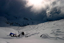 Early winter storm descending on the camp set up by the Planet Earth film crew at 3,000m altitude on the Gorner glacier in -20C, for the Mountains episode of the BBC tv series Planet Earth, Gorner Gla...