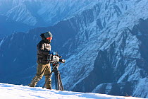 Camerman, Mark Smith, scouts Himalayan valleys over 2km deep in search of the elusive snow leopard, for the Mountains Episode of the BBC tv series Planet Earth, Himalayas, northern Pakistan (on the bo...