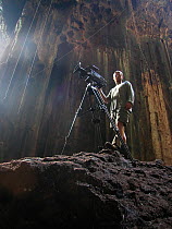 Ted Giffords (cameraman) filming bats and local Malaysian bird-nest collectors who risk their lives to collect swallows nests for birds nest soup, Gomantong Caves, Borneo, Malaysia, April 2004, filmin...