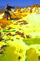 Martyn Colbeck filming the Dallol Hot springs, Danakil Desert (the world's hottest desert) Ethiopia, November 2003,  Filming for the Mountains episode of BBC NHU tv series, Planet Earth. Filming the o...