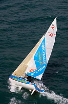 Miguel Danet and Damien Cloarec on Figaro yacht "Concarneau-St. Barthelemy", heeling over. Transat AG2R, Port la Foret, Brittany, March 2010.