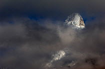 Ama Dablam mountain (6,812m) surrounded by clouds, Sagarmatha National Park, Khumbu, Himalayas, Nepal, November 2007