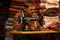 Man using sewing machine, Kathmandu, Nepal, December 2007