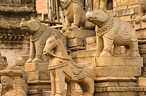 Stone stautes of Rhinoceroses and horses on the stairs of a temple, Bhaktapur, Kathmandu, Nepal, December 2007