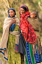Local woman with children in traditional dress, Simien Mountains NP, Ethiopia, December 2005