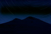 Star trails over Mount Elbrus (5,642m) at night, Caucasus, Russia, June 2008