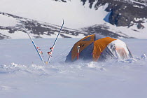Mountain tent and skis in wind at Patriot Hills. Antarctica, January 2006.