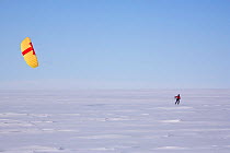 Man kite skiing as the wind picks up, Patriot Hills, Antarctica, January 2006.