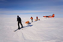 Skiers leaving their aircraft as they start on the 'Last Degree' expedition from 89 degrees south to the South Pole. Antarctica, January 2006.