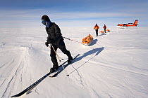 Skiers leaving their aircraft as they start on the 'Last Degree' expedition from 89 degrees south to the South Pole. Antarctica, January 2006.