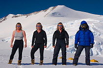 Mountain guide demonstrates clothing layers (underwear, midlayers and outer layers) at Mount Vinson Base Camp. Vinson Massif, Antarctica, January 2006. Digital composite.