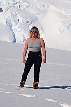 Mountain guide demonstrates clothing layers (underwear) at Mount Vinson Base Camp. Vinson Massif, Antarctica, January 2006.