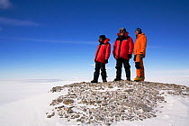 Three people hiking in the Patriot Hills as part of the Antarctic Experience. West Antarctica, January 2006.