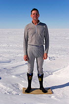 Man demonstrates clothing layers (underwear) at Mount Vinson Base Camp. Vinson Massif, Antarctica, January 2006.