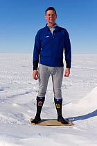 Man demonstrating clothing layers (mid layer) at Mount Vinson Base Camp. Vinson Massif, Antarctica, January 2006.