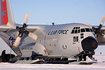 C130 on the skiway at Patriot Hills as ALE (Antarctic Logistics and Expeditions) staff load it with scientific equipment. Antarctica, January 2006.