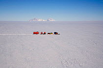 Chilean Traverse, pulled by the Camoplast, to survey the Ellsworth under ice Lake. Pirit Hills on the horizon, Antarctica, January 2006.