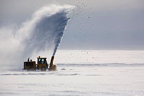 Small snow blower clearing snow off the Blue Ice Runway, Patriot Hills. Antarctica, January 2006.