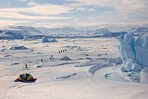 Aerial view of safety tent and passengers walking to the Emperor Penguin Colony at Snow Hill Island. Antarctica, October 2006.