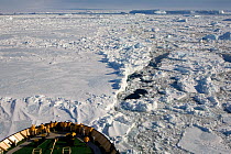 Tourist on the bow of the "Kapitan Khlebnikov" in pack ice in Erebus & Terror Gulf. Antarctica, October 2006.