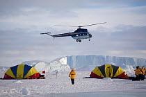 Russian Mi-2 helicopter by the safety tents at Snow Hill Island. Antarctica, October 2006.
