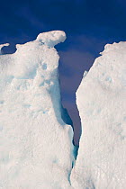 Detail of an iceberg crack against a blue sky. Antarctica, October 2006.
