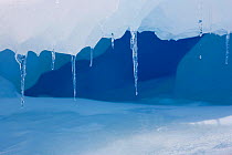 Icicles hanging from a ledge on an iceberg, Antarctica, October 2006.