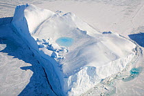 Pool of water collecting on top of thawing Iceberg. Antarctica, October 2006.