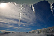 Icicles hanging from an undercut iceberg by the shore of Snow Hill Island, Antarctica, October 2006.