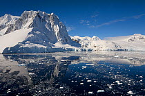 Reflections of mountains and glaciers, Lemaire Channel, Southern Ocean, Antarctica, October 2006.