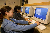Inuit pupil engrossed in computer studies. Igloolik, Nunavut, Canada, April 2008. Model released.