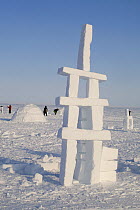 Igloos and Inukshuks built from snow as part of the celebrations for Hamlet Day in Igloolik, Nunavut, Canada, April 2008.
