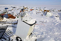 Broken washing machines and other scrap on the rubbish dump, Igloolik. Nunavut, Canada, April 2008.