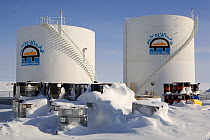 Large oil storage tanks in the Inuit community of Rankin Inlet. Nunavut, Canada, April 2008.
