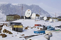Satellite dishes bringing TV, phones and the internet to the Inuit community of Pangnirtung. Nunavut, Canada, April 2008.