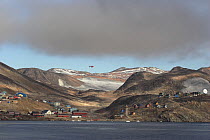 Helicopter flying over the Inuit village of Scoresbysund on the coast of Scoresbysund Fjord. East Greenland, September 2005.