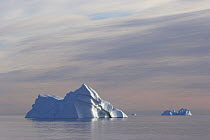 Iceberg in a calm sea, Scoresbysund Fjord, East Greenland, September 2005.