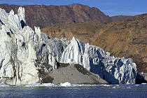 Sand covers a central part of the advancing Eielson Glacier. Rypefjord, East Greenland, September 2005.