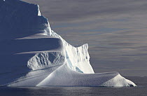Iceberg catches low rays of light. East Greenland, September 2005.