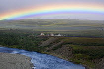 Rainbow over a Khanty reindeer herders' camp by the Bolshaia Paipudyna River in the Polar Urals Mountains. Yamal, Western Siberia, Russia, Summer 2007.
